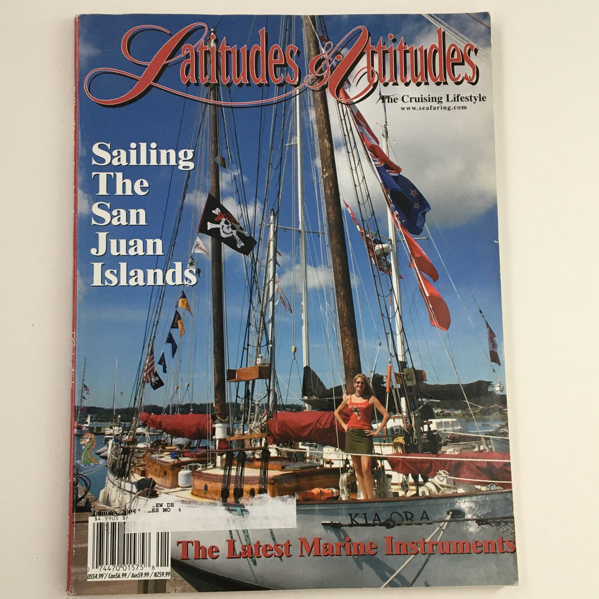 Cover of Latitudes & Attitudes Magazine January 2005 featuring 'Sailing The San Juan Islands' with a sailboat in the background and a model posing on the deck.