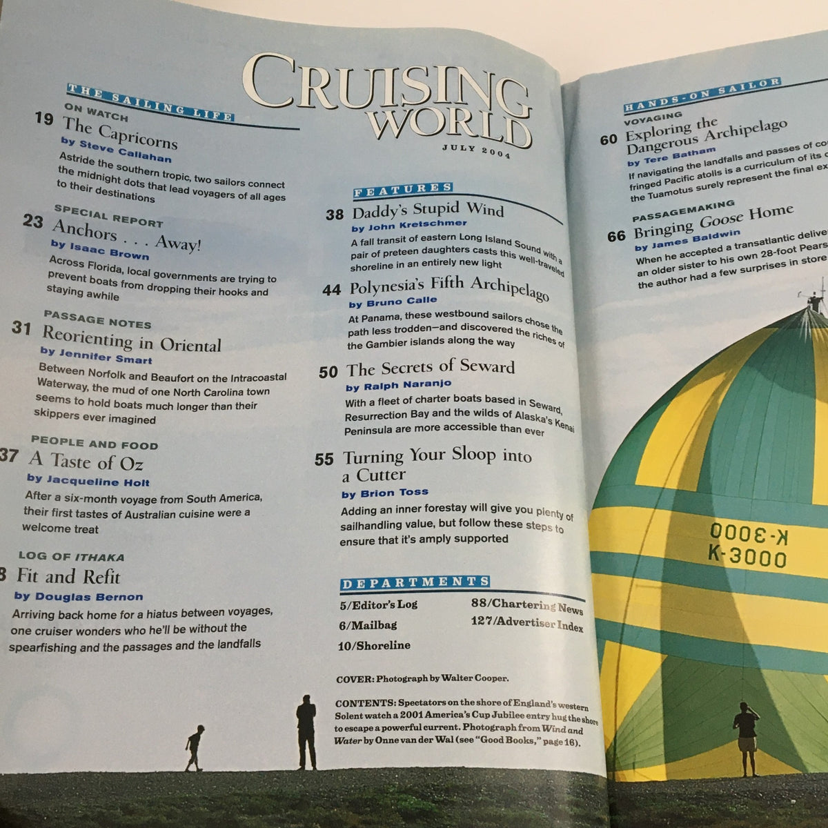 Inside page of Cruising World Magazine July 2004 showcasing the table of contents, including features on anchoring, sailing techniques, and cruising adventures.