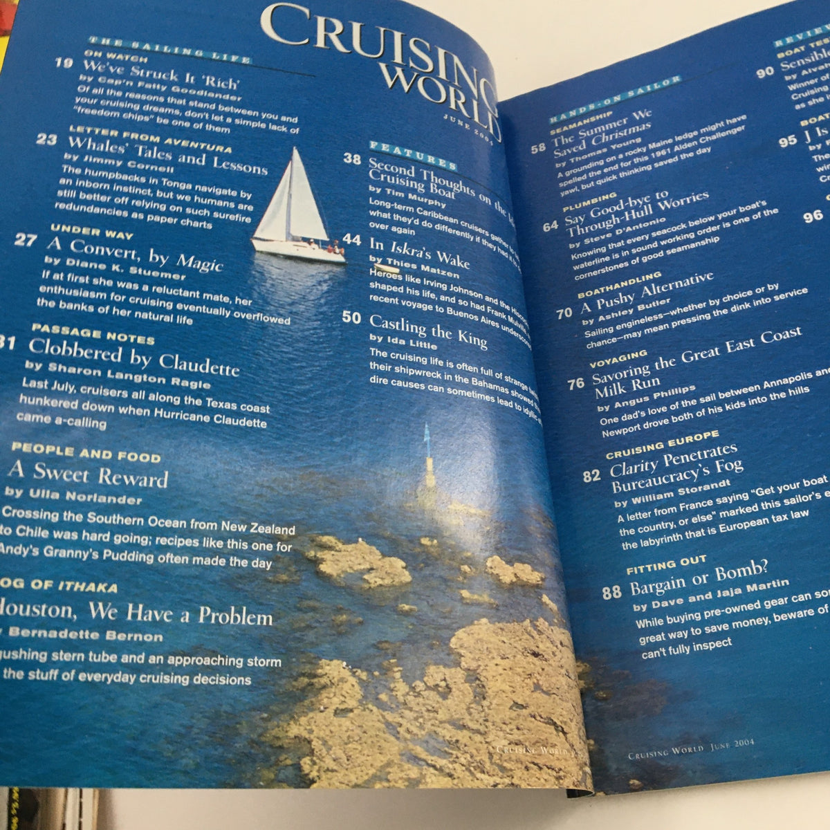 Cruising World Magazine June 2004 interior page featuring the table of contents and articles such as 'Whales' Tales and Lessons' and 'In Iskra's Wake'. This page highlights content relevant to sailing enthusiasts, showcasing a variety of nautical topics.
