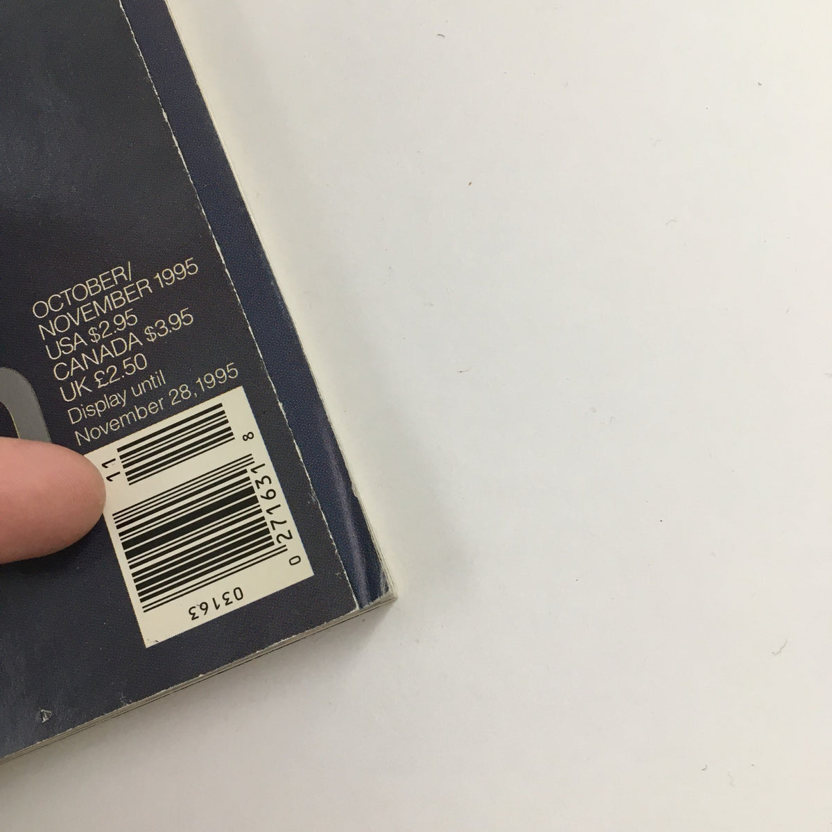 The back cover of George Magazine October 1995 displaying pricing, publication date, and a barcode, showcasing its vintage elements.