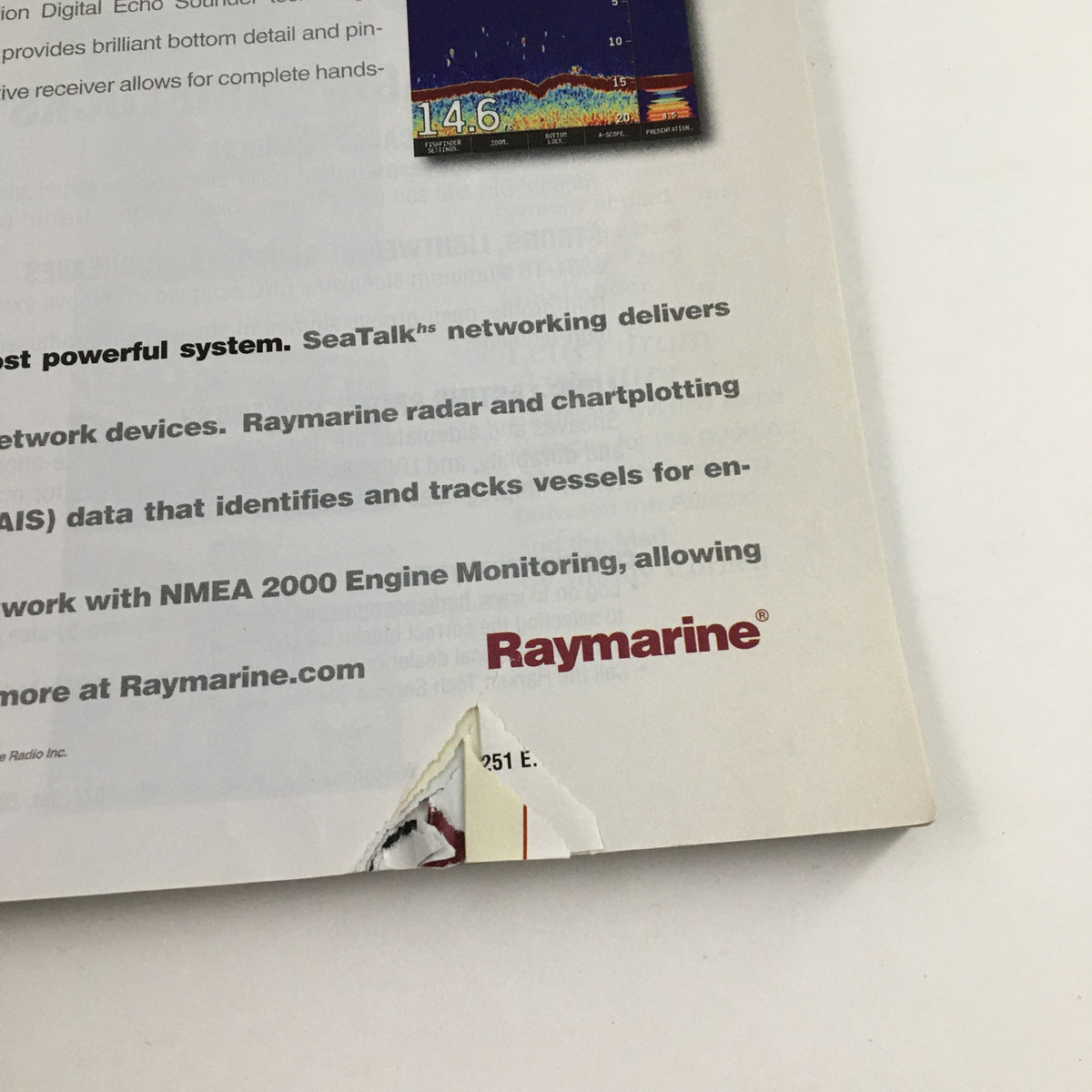 Back cover of Cruising World Magazine November 2006, highlighting SeaTalk and Raymarine products with visible damage and wear.