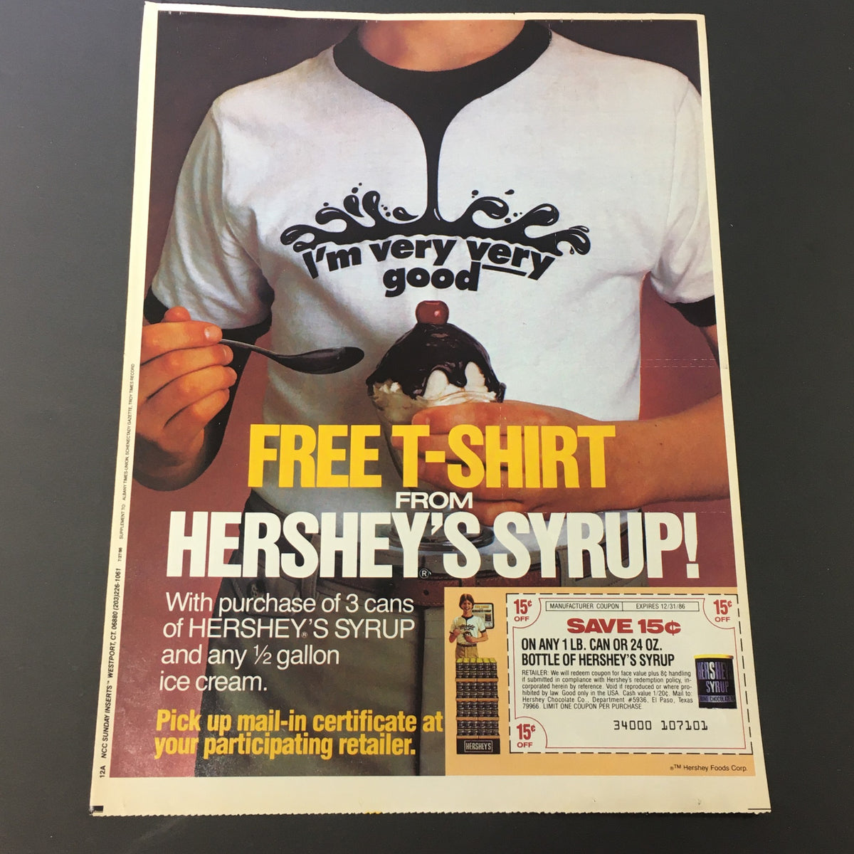 VTG Retro 1986 Hershey's Syrup FREE T-Shirt advertisement featuring a person holding ice cream, showcasing an offer to receive a free T-shirt with the purchase of Hershey's Syrup.