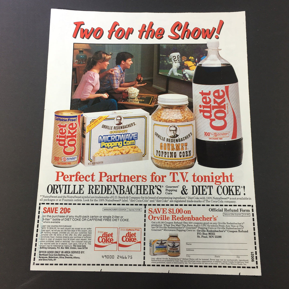Vintage 1985 Coca-Cola Diet Coke and Orville Redenbacher's Popcorn ad coupon showcasing promotional offers and imagery of Diet Coke, popcorn packages, and a couple enjoying TV time.
