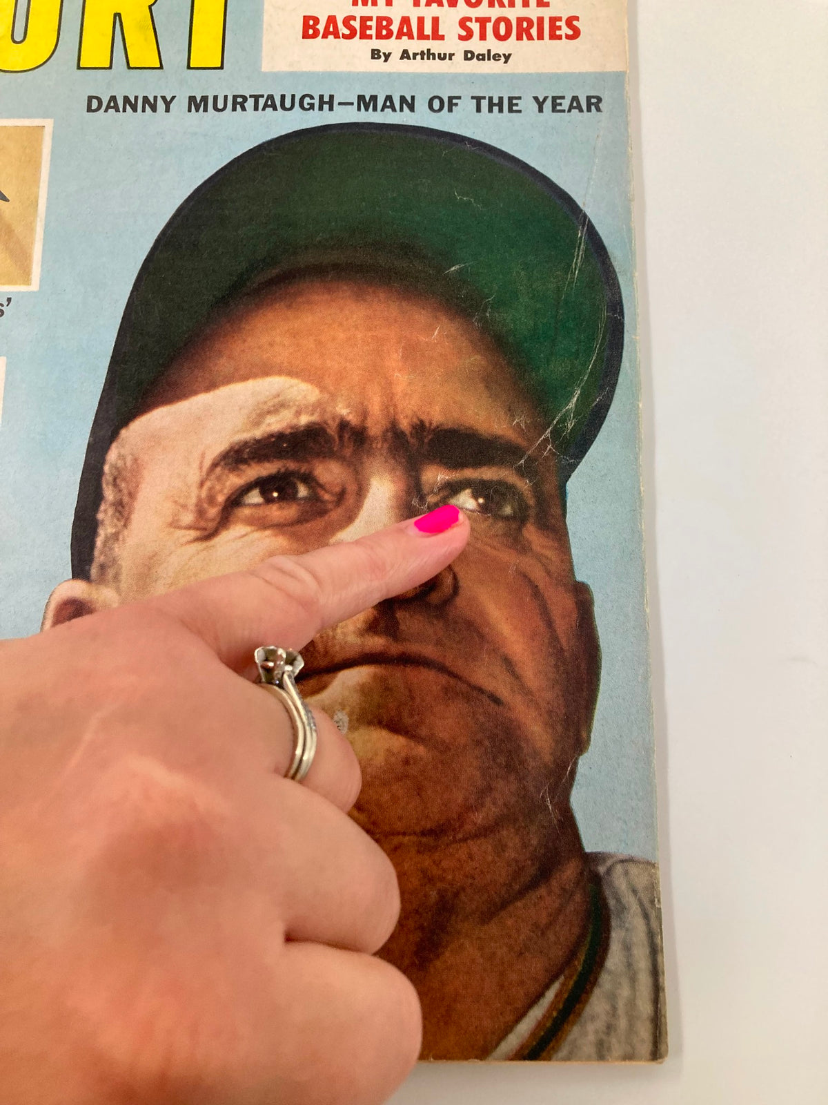 Close-up of the VTG Sport Magazine February 1961 cover showing Danny Murtaugh, noted as Man of the Year, with a finger pointing at the magazine's details.