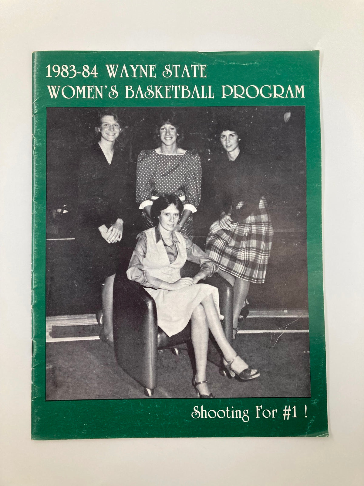 Cover of the VTG 1983-1984 Wayne State Women's Basketball Program featuring four women, showcasing the title 'Shooting For #1!'.