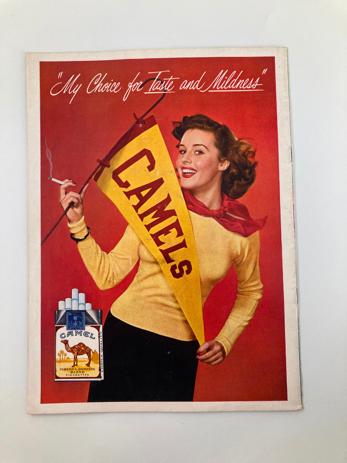 Vintage advertisement from the October 14 1950 NCAA USC Trojans vs California Golden Bears Pigskin Review featuring a model promoting Camel cigarettes.