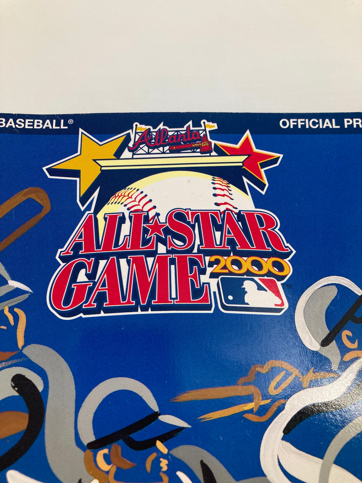 Close-up of the 2000 Major League Basketball All Star Game Official Program logo, highlighting the event title with baseball and star graphics.