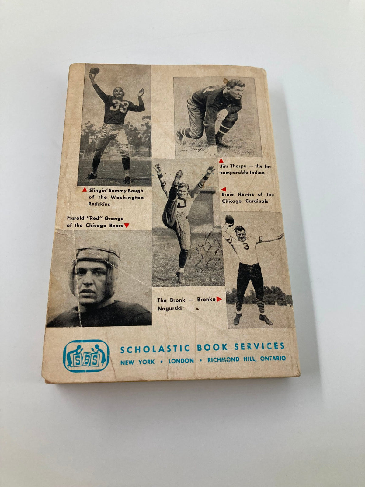 Back cover of Vintage 1963 Pro Football's Hall of Fame by Arthur Daley, displaying images of iconic football players.