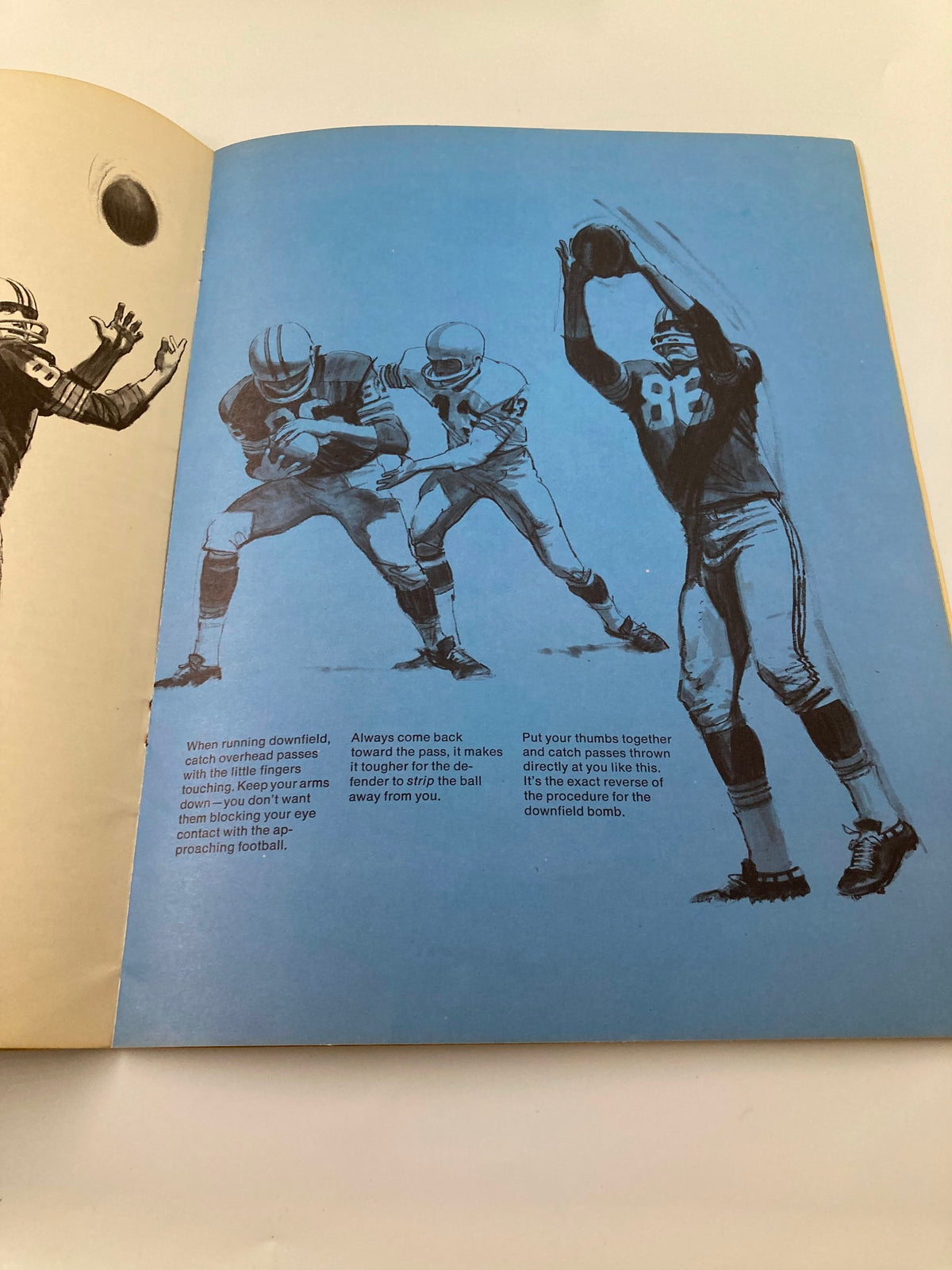 Instructional page from VTG 1968 Winning Football by Bart Starr, depicting football players receiving a pass, highlighting essential game strategies.