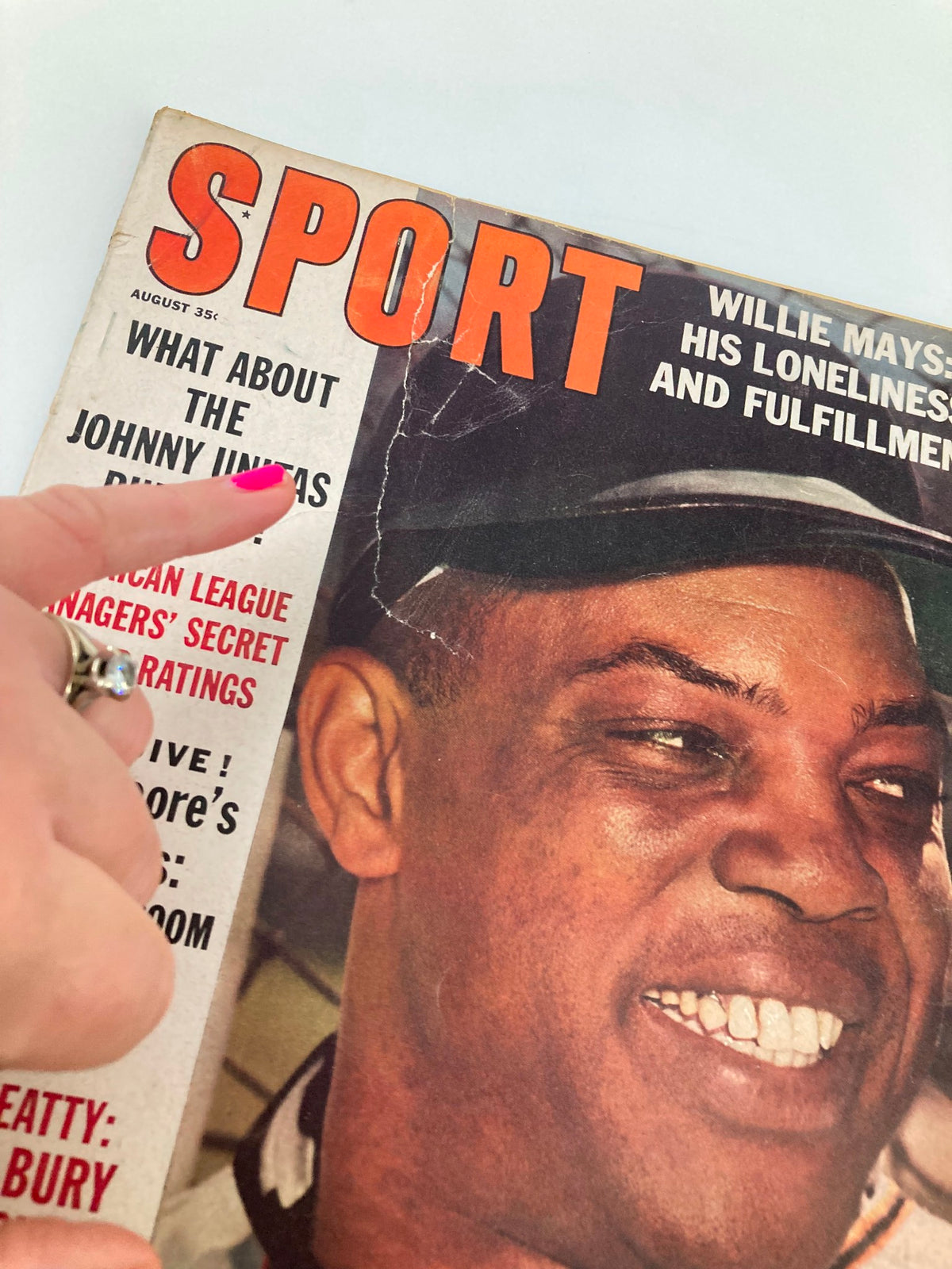 Close-up image of the VTG Sport Magazine August 1963 cover showing Willie Mays smiling, with the title 'Willie Mays: His Loneliness and Fulfillment' and text discussing Johnny Unitas rumors.