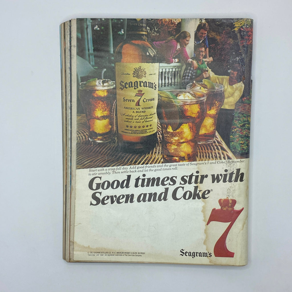 Advertisement from VTG Playboy Magazine December 1982, promoting Seagram's 7 whiskey with a celebratory scene, a nostalgic depiction of 1980s culture.