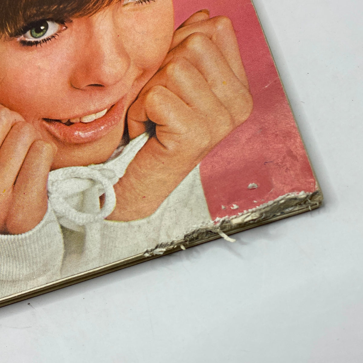 Close-up of the cover detail of Playboy Magazine August 1966 with Susan Denberg's expression, highlighting the artwork and nostalgic design elements.