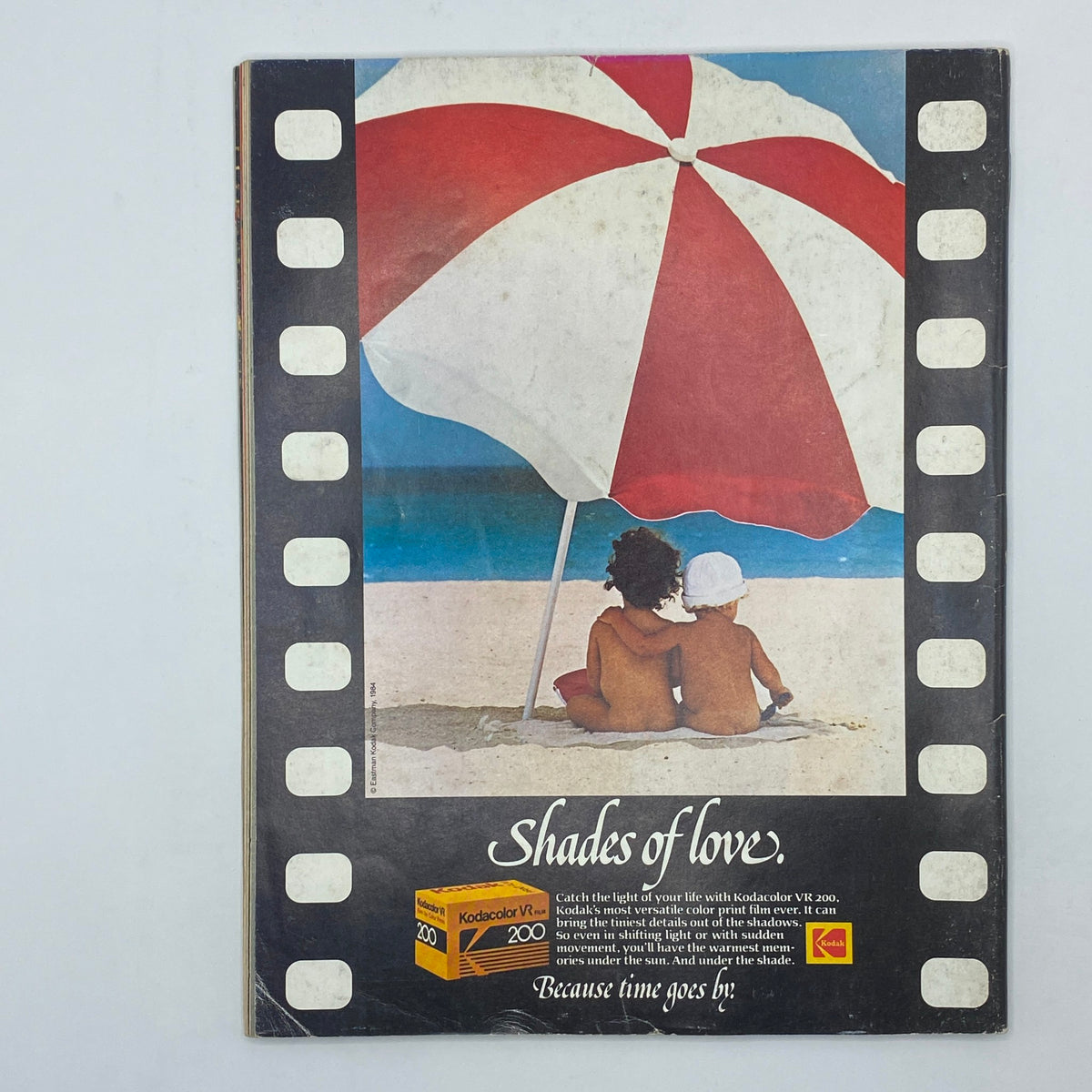 Back cover of VTG Omni Magazine August 1984 featuring a nostalgic advertisement for Kodakcolor VR 200 film, illustrated with a beach scene and the phrase 'Shades of love'.