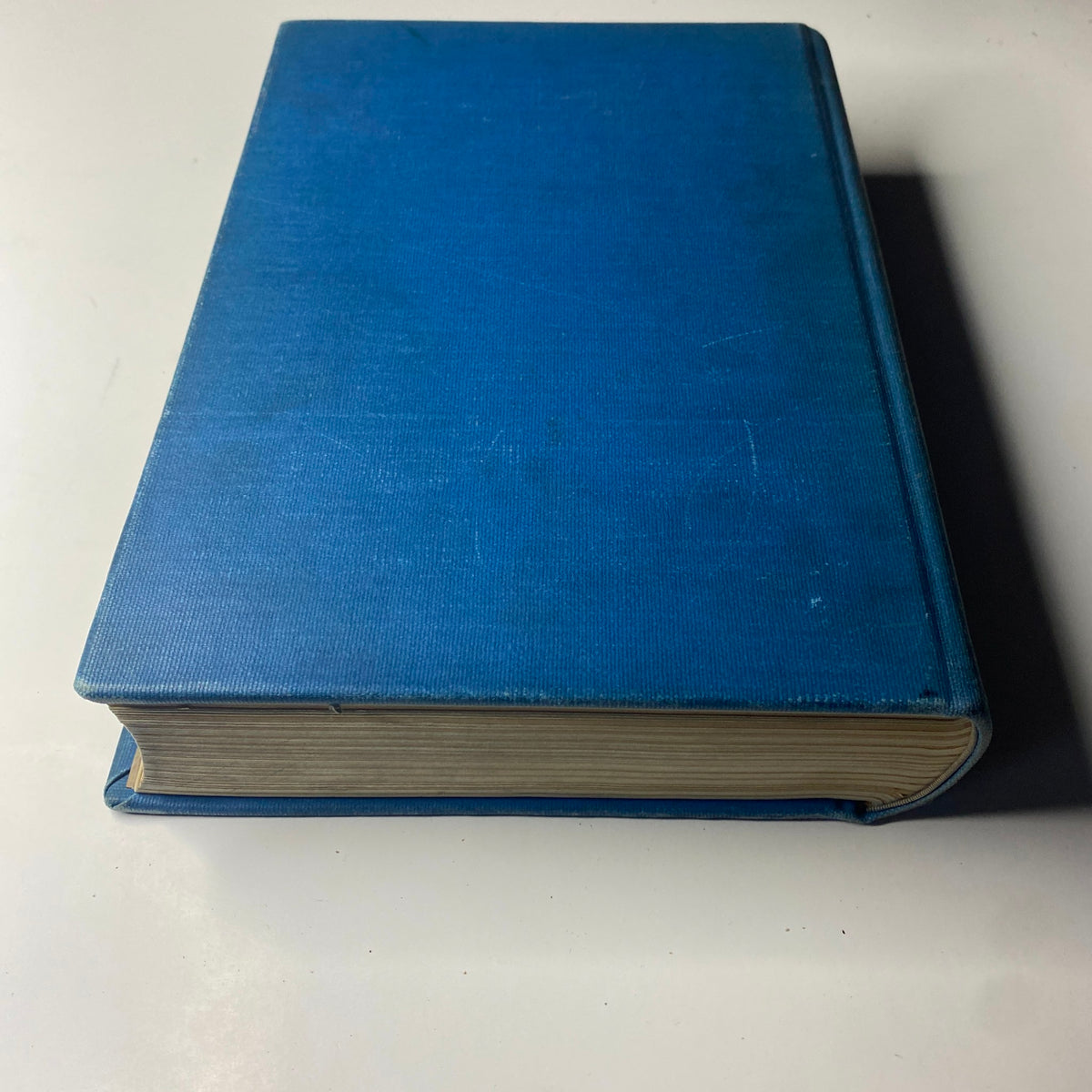 Side view of the Library Bound Weekly Edition of Time Magazine from October 5 to December 21, 1942. The book shows a blue cover and gold-edged pages.