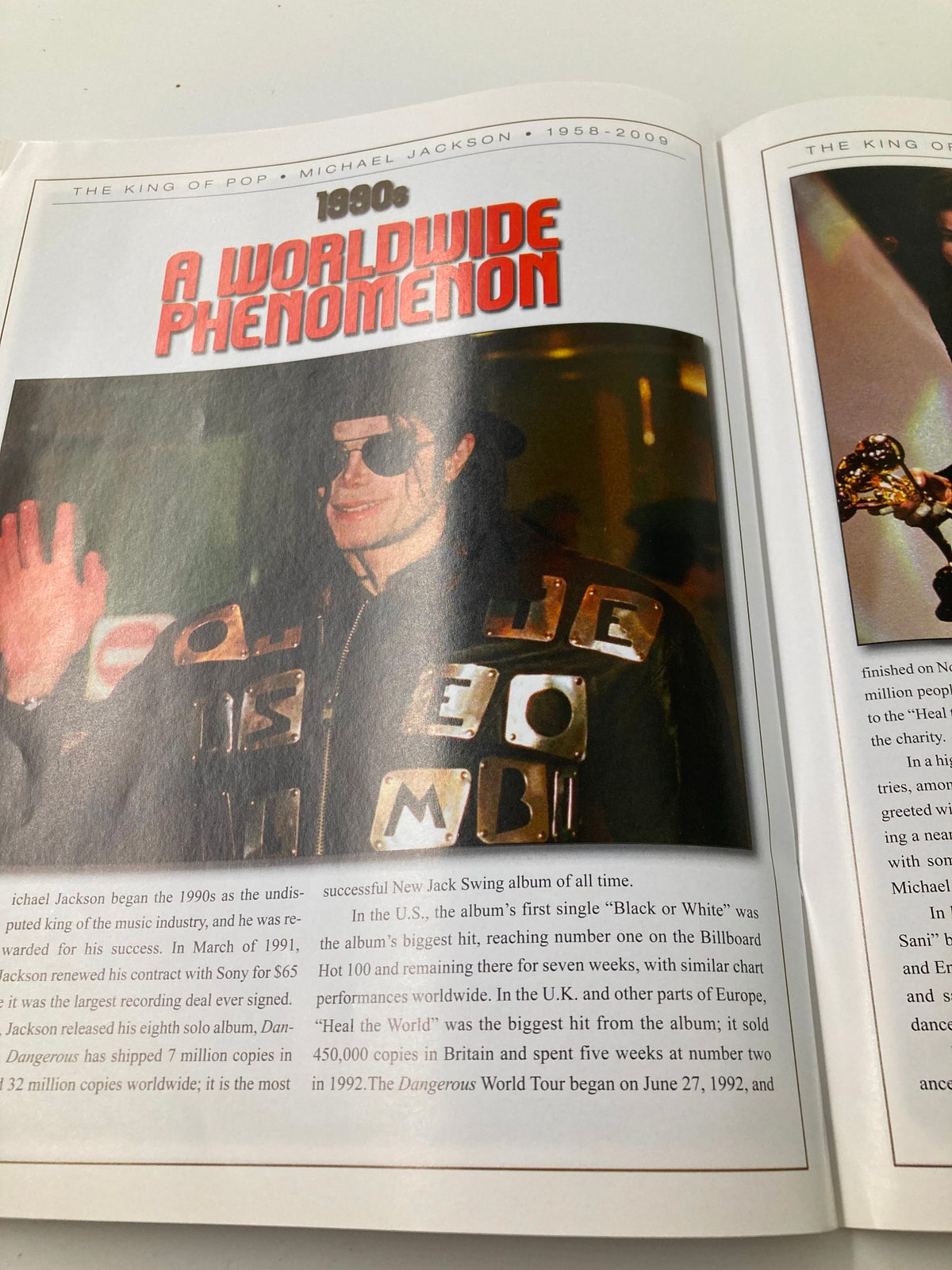 Michael Jackson Collector's Photo Gallery #07 presenting a page on his worldwide phenomenon in the 1990s, showcasing his impact on music and culture.