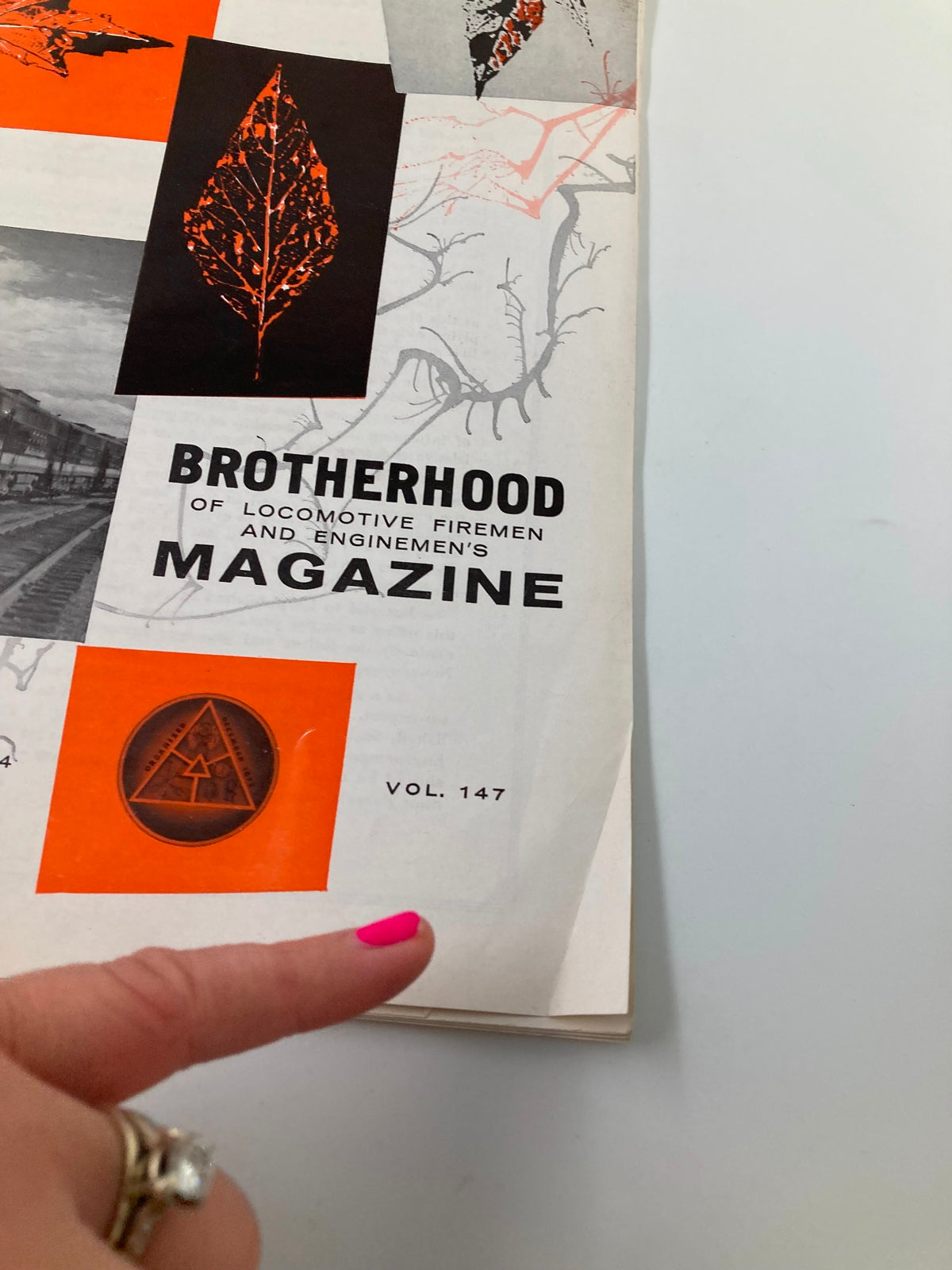 Detailed view of the VTG Brotherhood Magazine October 1959 Vol 147 cover, showcasing the title and volume number with a finger pointing.