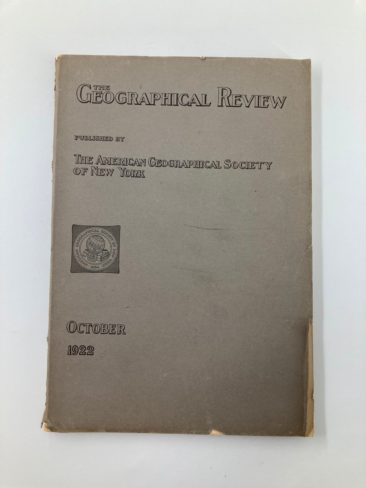 Cover of The Geographical Review published by The American Geographical Society of New York in October 1922, showcasing its historical significance.