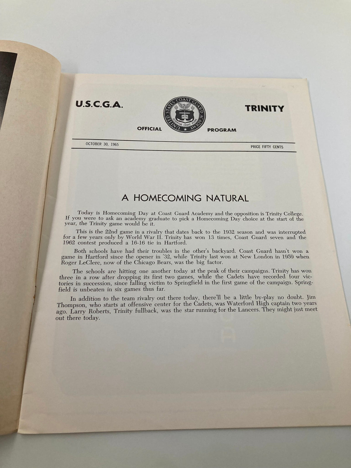 Interior page of the October 30, 1965 NCAA Football program featuring a section titled 'A Homecoming Natural', discussing the rivalry between U.S.C.G.A. and Trinity.