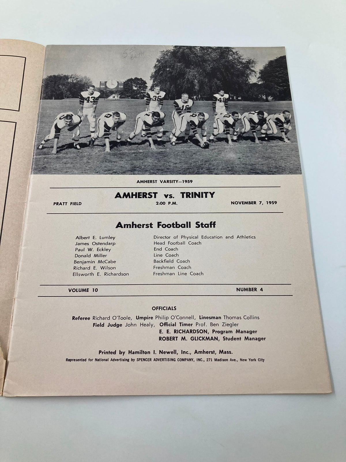 The interior page of the November 5 1959 Trinity vs Amherst High School Football Official Program presenting the Amherst football staff information and game details.