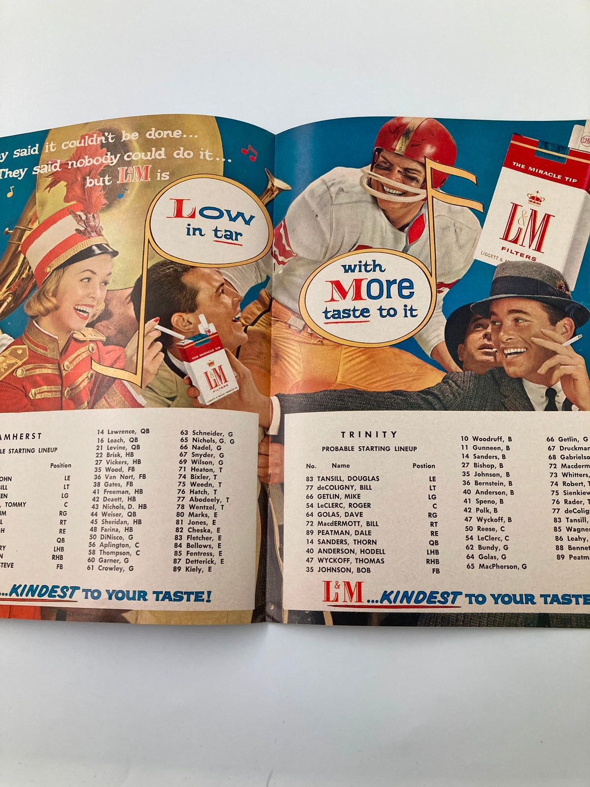 Official program page from November 5 1959 Trinity vs Amherst High School Football featuring team lineups and a colorful advertisement.