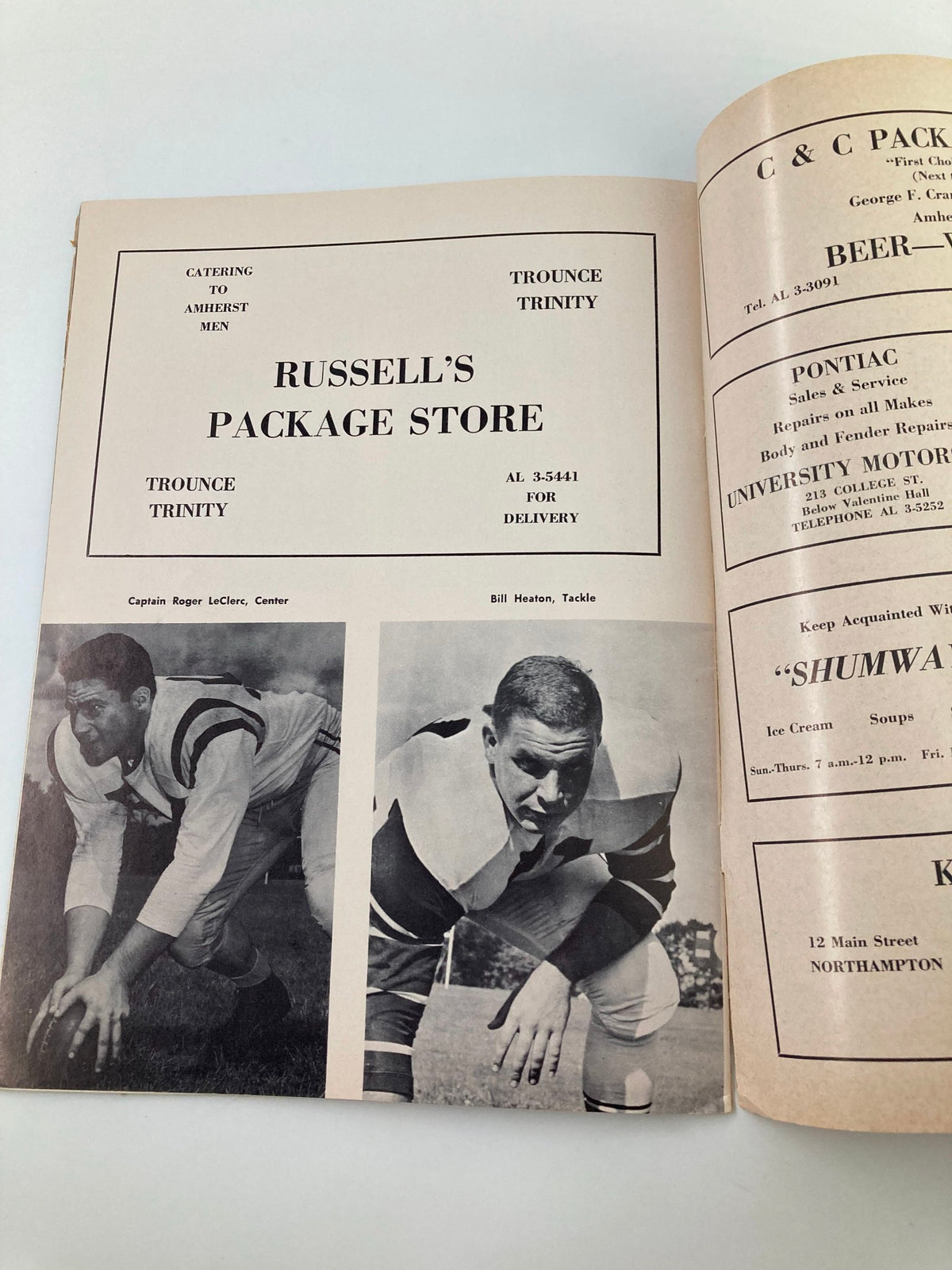 Image from the November 5 1959 Trinity vs Amherst High School Football program featuring player stats and local business advertisements.