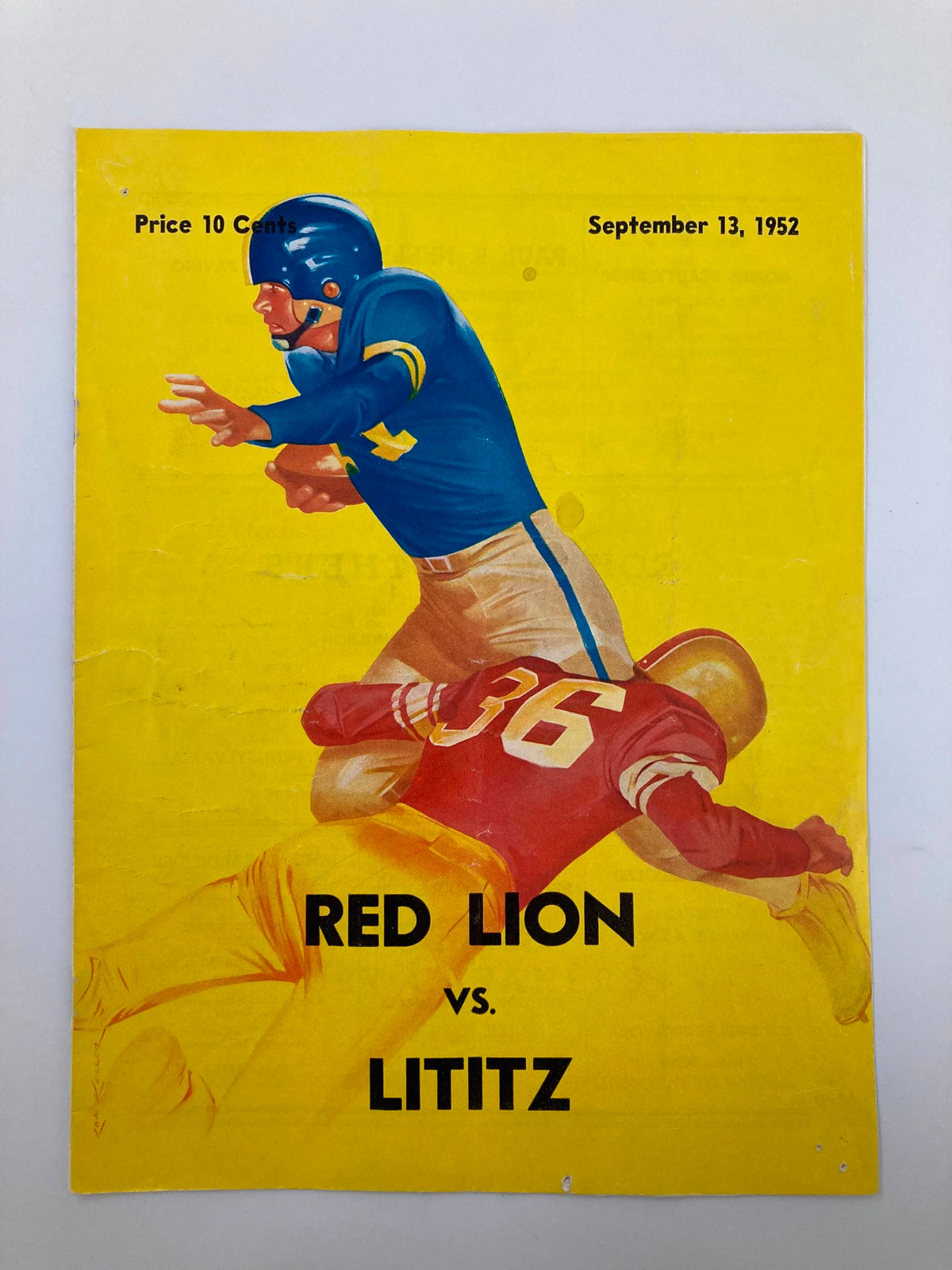 Official program cover for the September 13 1952 High School Football game featuring Red Lion vs. Lititz, showcasing a dramatic illustration of a football player in action.