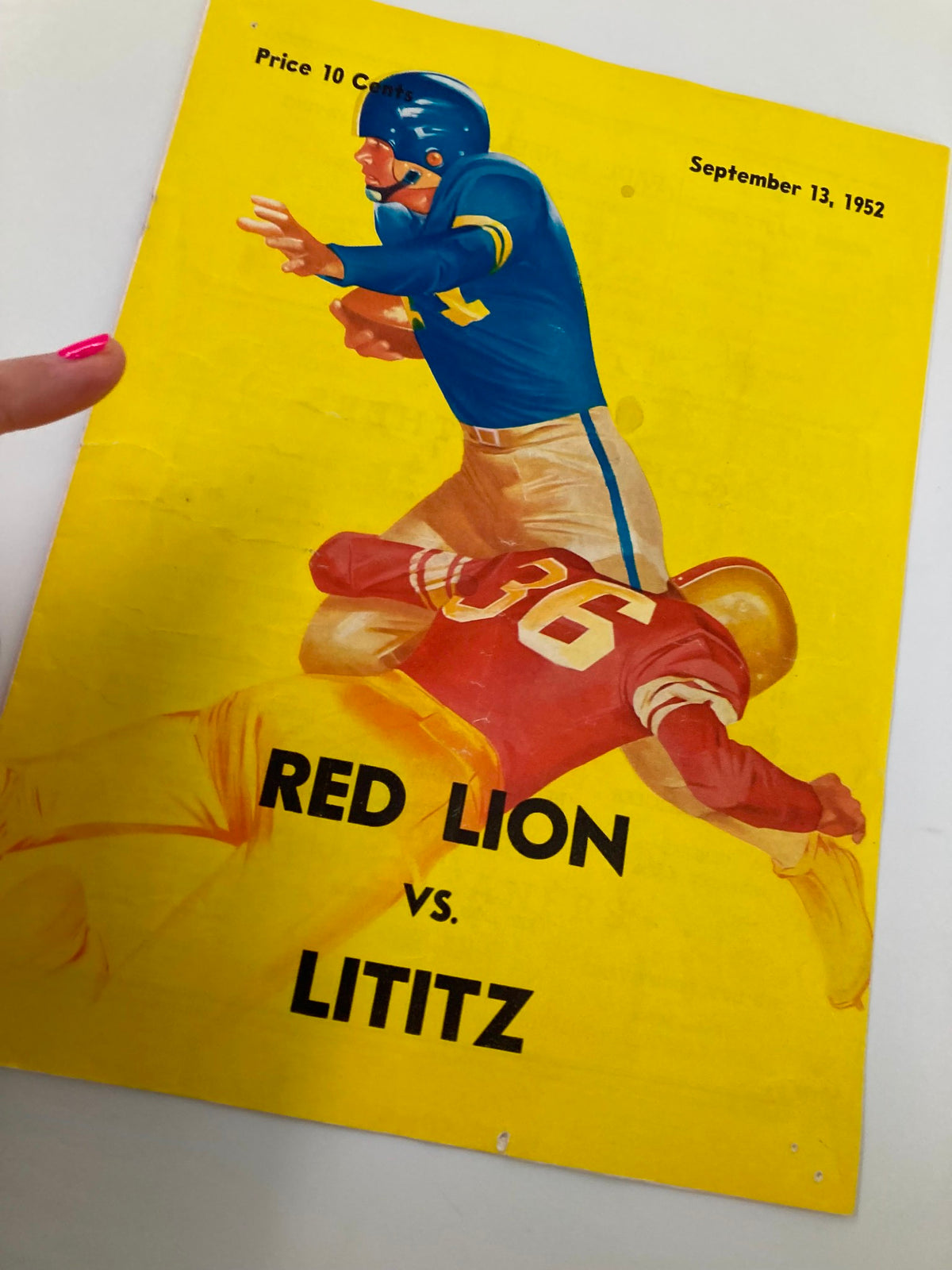 Close-up of the Official program cover for the September 13 1952 High School Football game between Red Lion and Lititz, highlighting the vintage design and athletic theme.