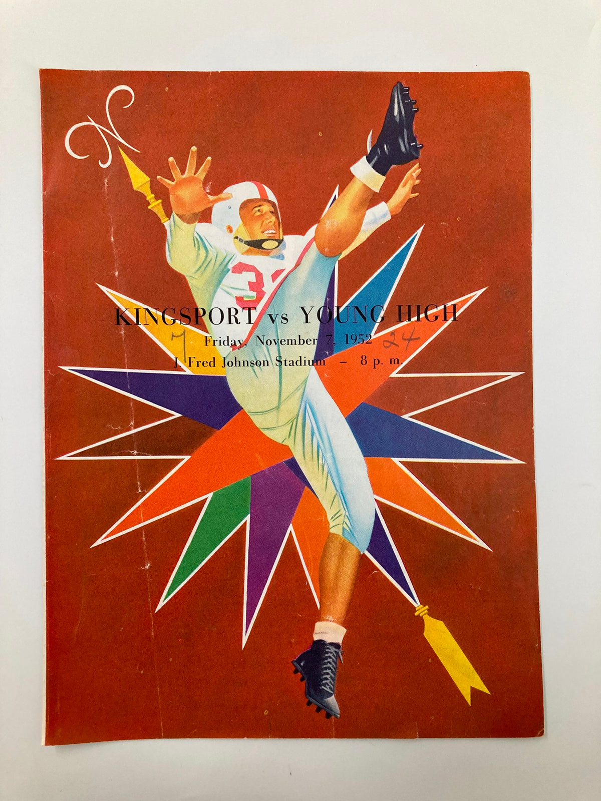 Cover of the Official Program for the November 7, 1952 Football game between Kingsport and Young High, featuring a dynamic illustration of a player in action.