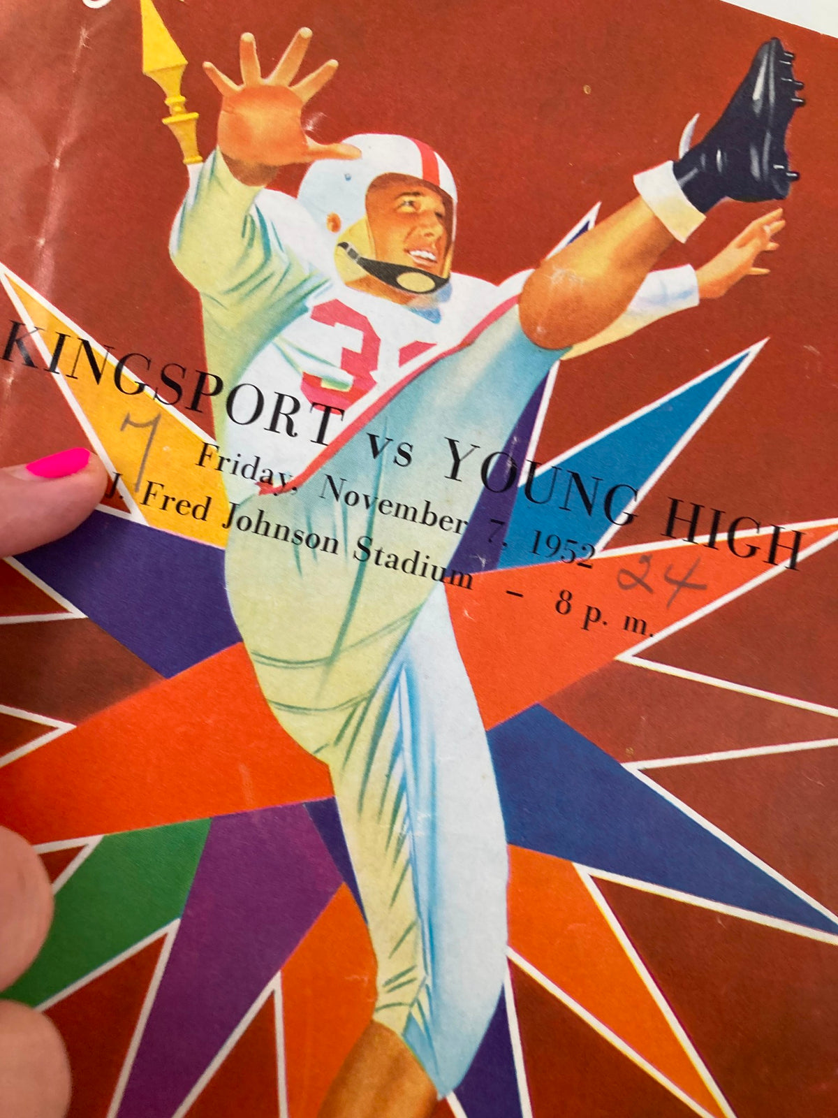 Cover of the official program for the Kingsport vs Young High football game on November 7, 1952, showcasing colorful graphics and player illustration.