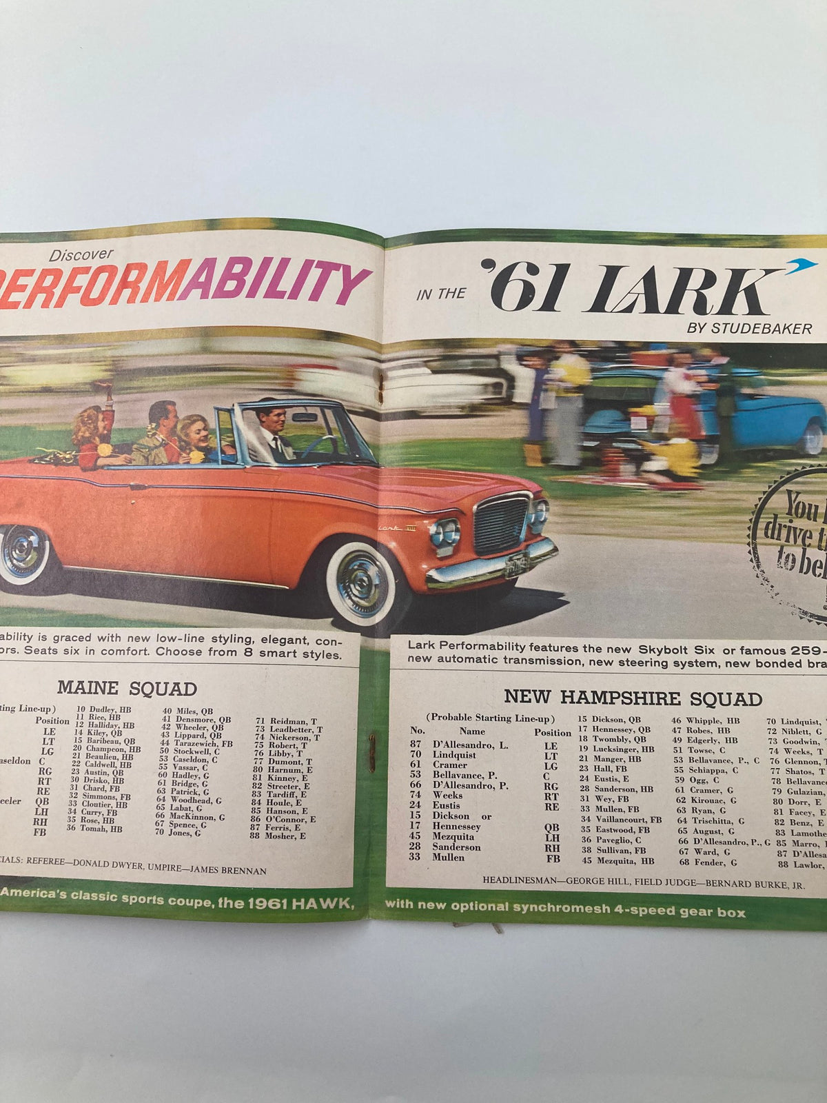 A vintage advertisement for the 1961 Studebaker Lark, showcasing features of the car alongside Maine and New Hampshire squad listings from the October 8 1960 Football Maine New Hampshire Homecoming Souvenir Official Program.