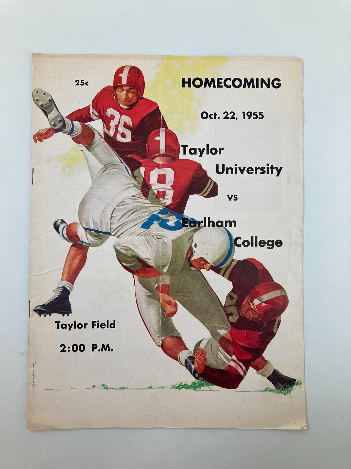 Vintage October 22, 1955 Football Program for the match between Taylor University and Earlham College featuring dynamic cover art, highlighting the spirit of college football.