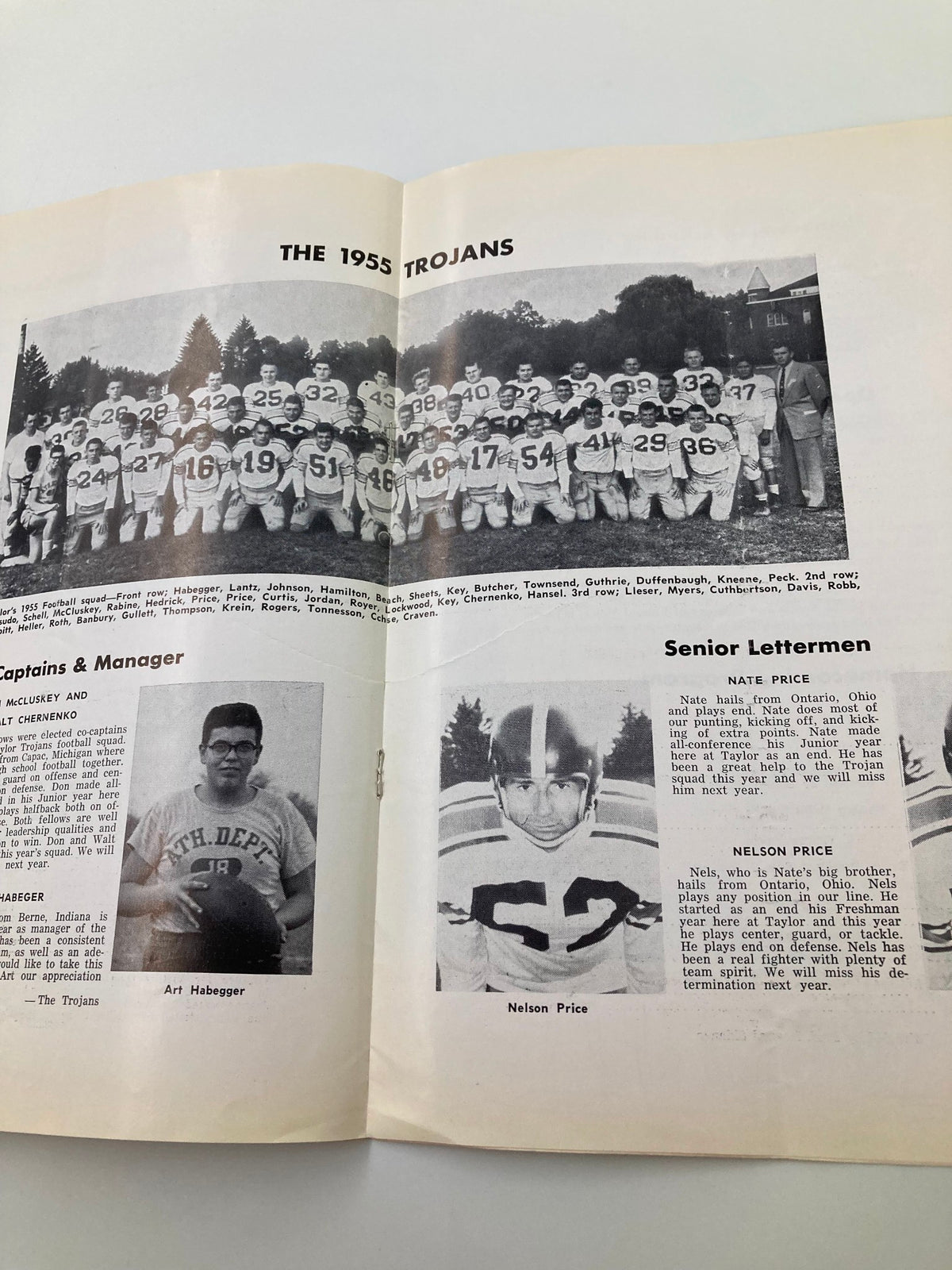 Another inside page of the 'VTG October 22 1955 Football Taylor University vs Earlham College Program' displaying the 1955 Taylor University Trojans team photo and player details.