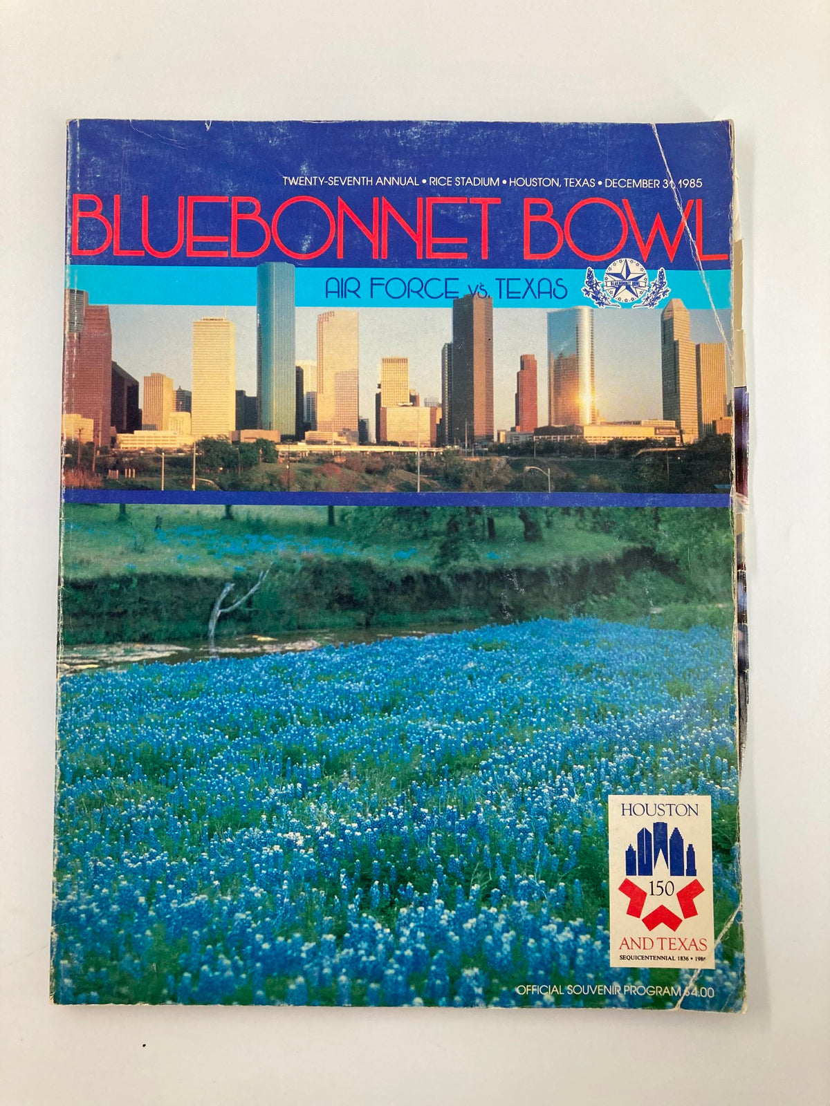 VTG December 31 1985 Air Force vs Texas Bluebonnet Bowl Official Program cover showcasing Houston's skyline and bluebonnet flowers.