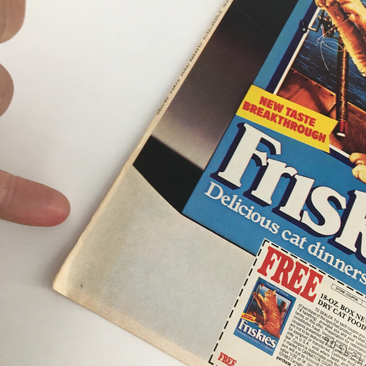 Close-up of 1983 Friskies Delicious Cat Dinners Circular Coupon Advertisement focusing on the edge of the ad and the promotional features, showcasing the Free offer for new dry cat food.