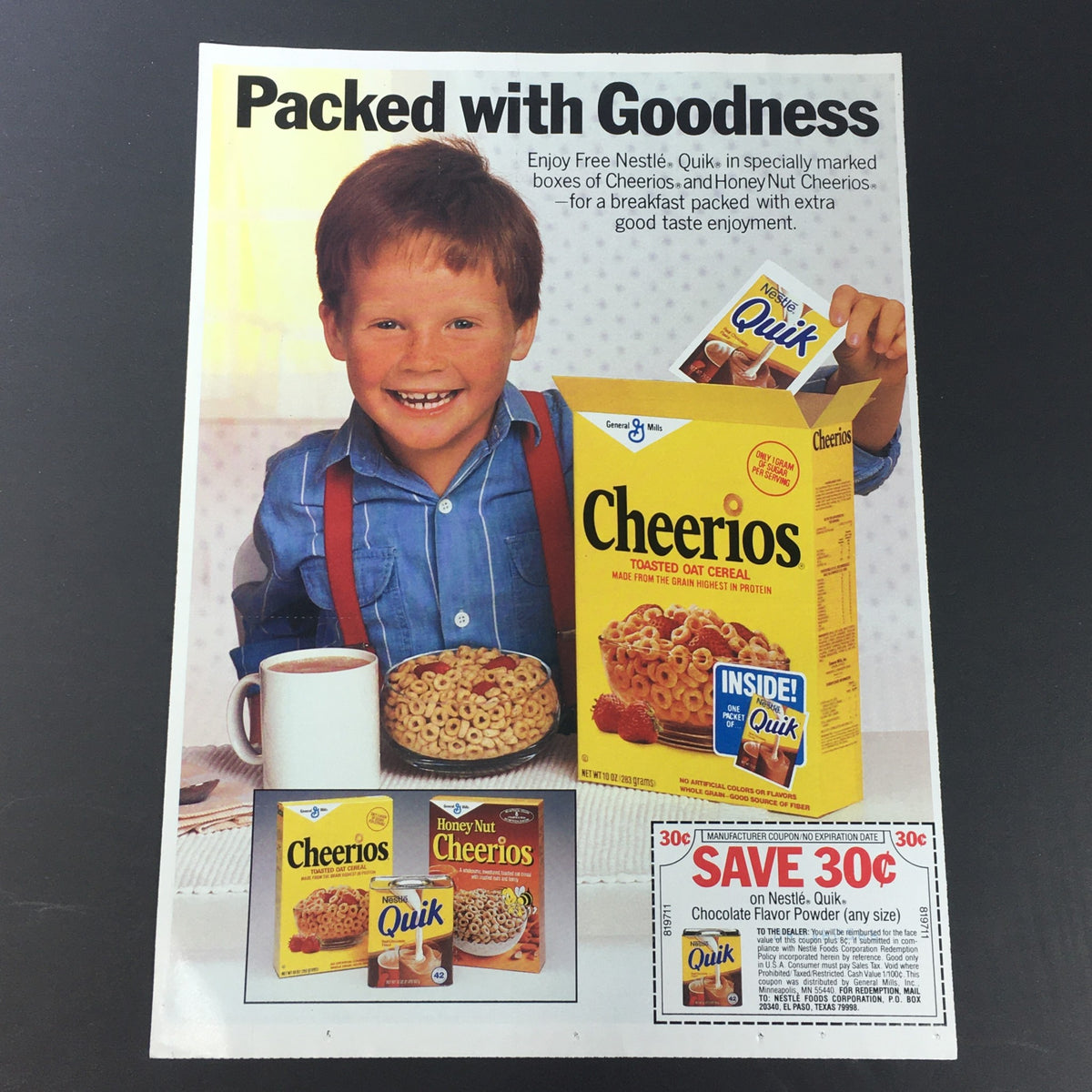VTG Retro 1987 Nestle Quick Chocolate Flavor Powder Milk Print Ad featuring a young boy with Cheerios cereal, showcasing a coupon for savings.