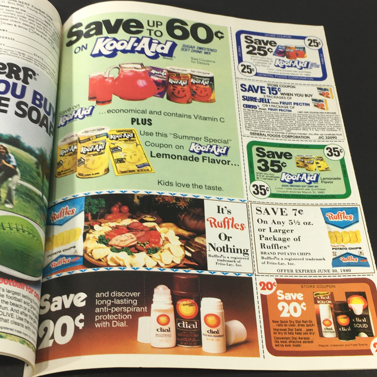 Vintage Kool-Aid advertisement offering savings on multiple flavors, featuring promotional prices and nostalgic food packaging, reflective of popular 1980's drink offerings.