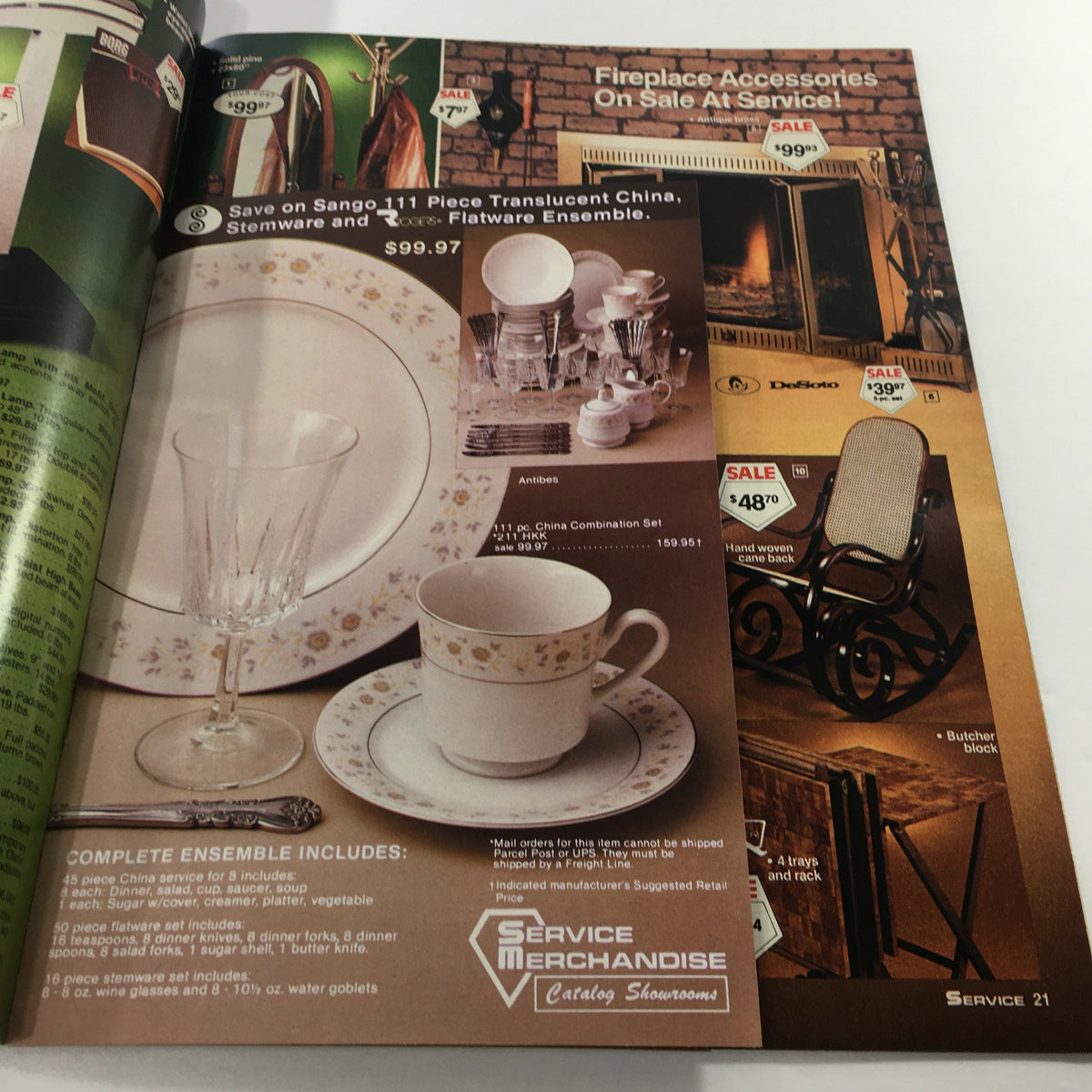 VTG 1982 Service Merchandise Catalog Showroom displaying a collection of china and flatware alongside fireplace accessories on sale.