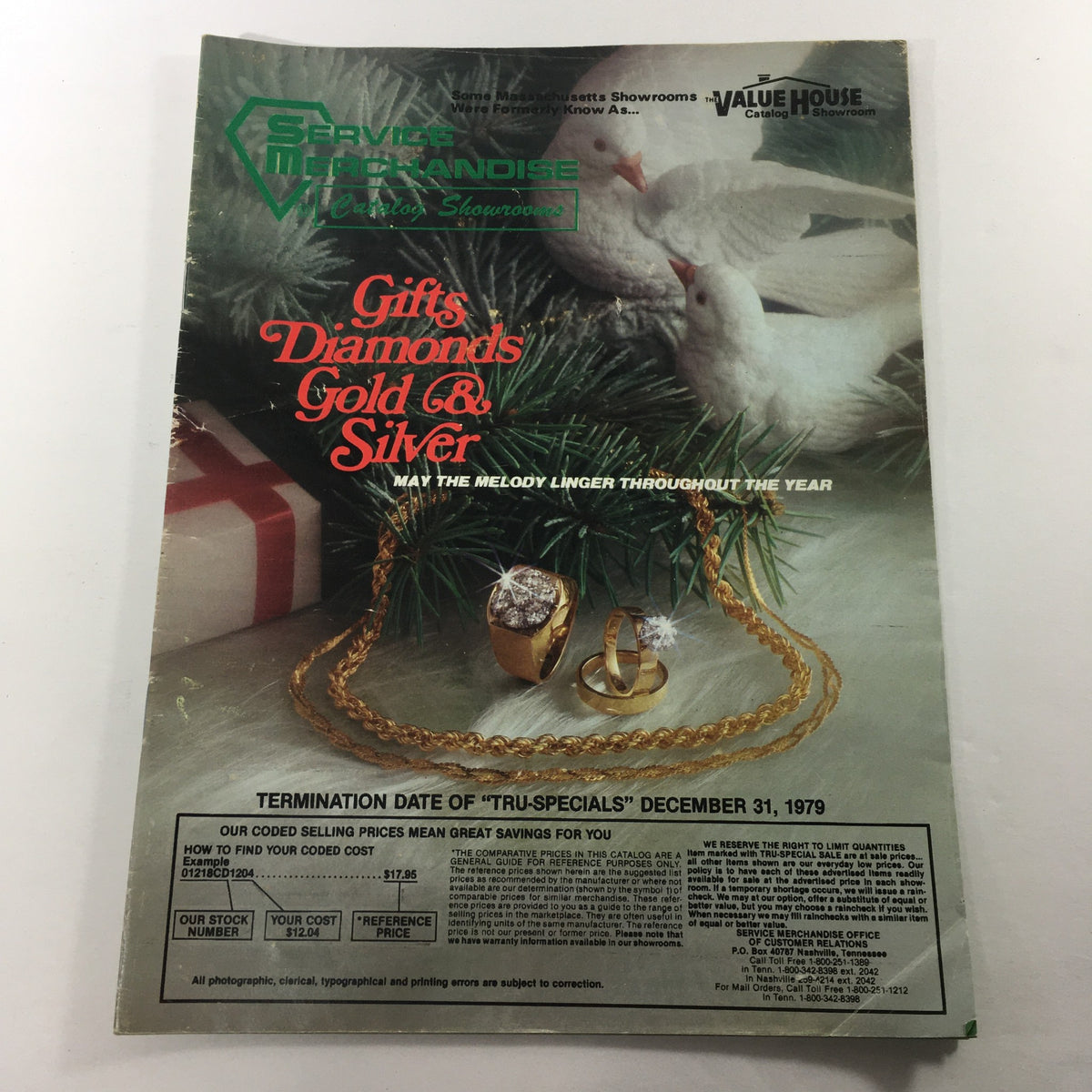 Cover of the VTG 1979 Service Merchandise Catalog Showroom Gifts Diamonds Gold & Silver Guide featuring jewelry against a festive background with doves and Christmas decorations.