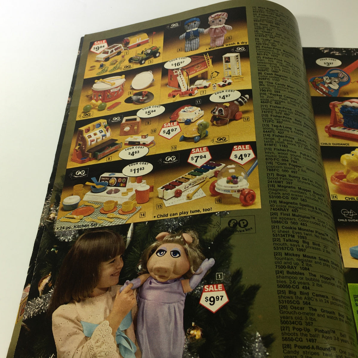 VTG 1980 Service Merchandise Catalog Showroom Holiday Toy Sale Price Guide displaying various musical toys and play sets, highlighting items for imaginative play.