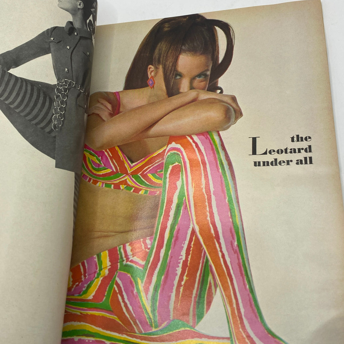 Stylish editorial photo from July 1967 VTG Vogue Magazine featuring a model in colorful leotard fashion, showcasing trendy designs.