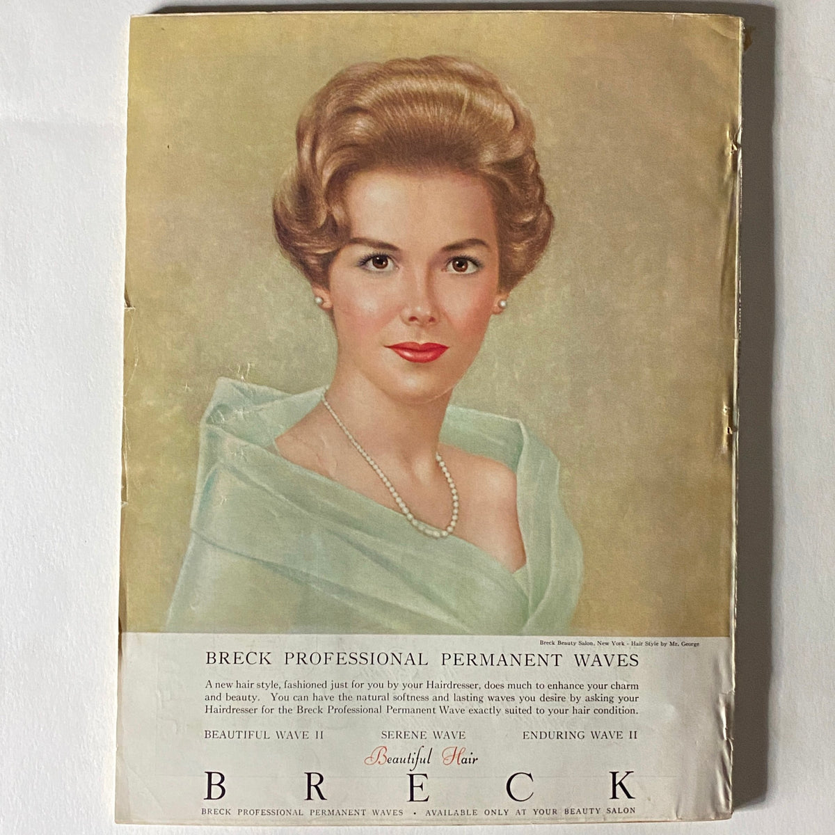 VTG Vogue Magazine December 1962 Christmas Issue cover page with a beautiful woman promoting Breck Professional Permanent Waves, highlighting beauty trends of the era.