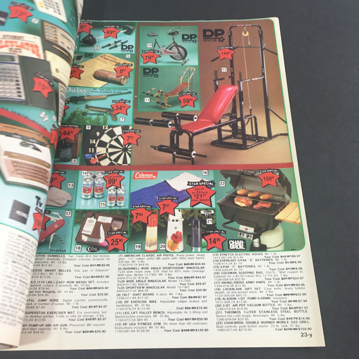 VTG December 1983 Present Co. Holiday Sale Catalog page displaying exercise equipment and other household items with price tags, emphasizing holiday sales and promotions.