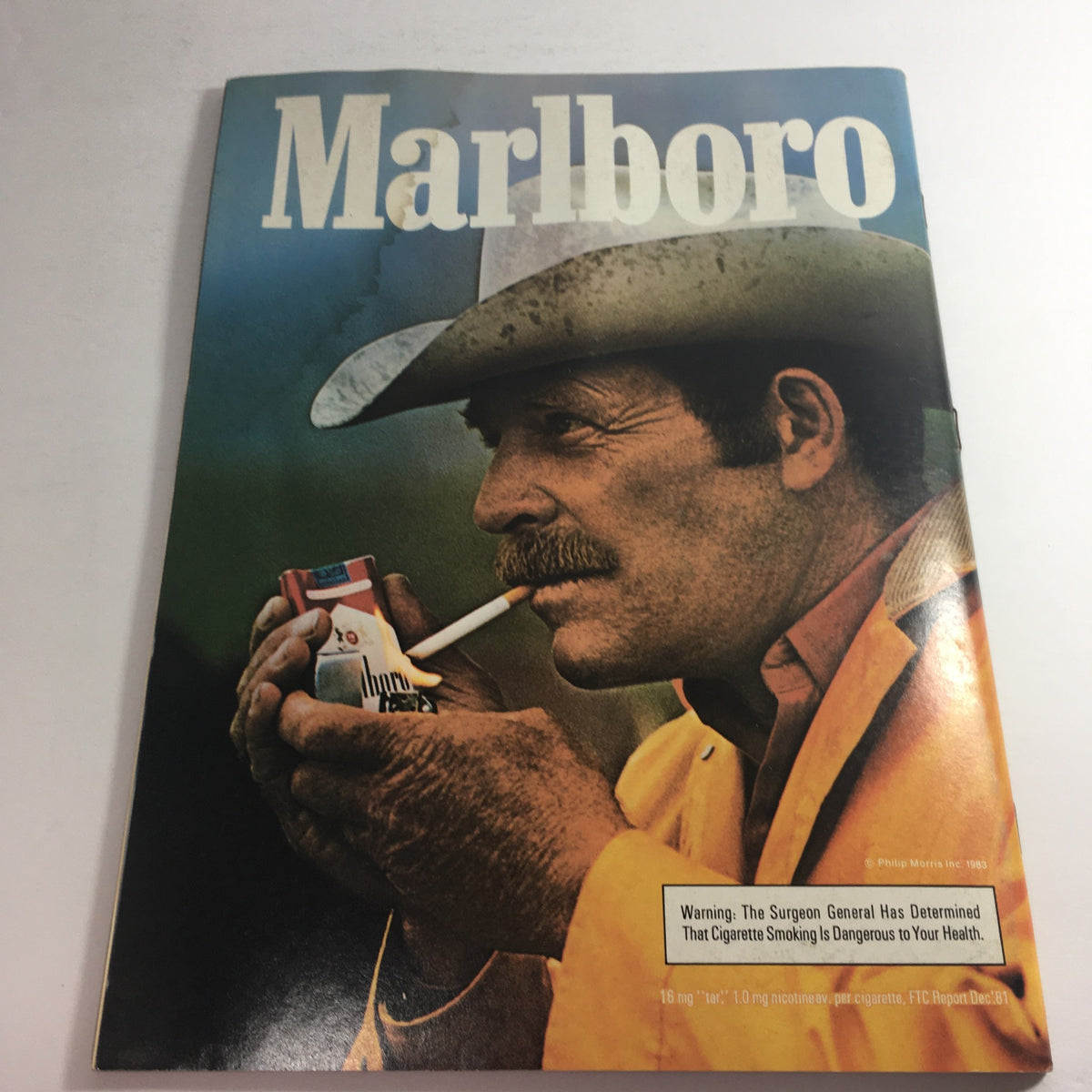 Vintage Marlboro advertisement featuring a man in a cowboy hat, displayed on the cover of the USFL Kickoff Official Magazine 1983 Vol. 1 #5.