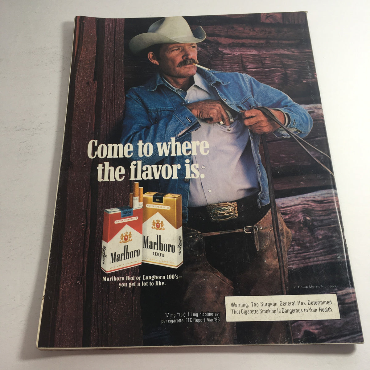 Front cover of the VTG USFL Kickoff Official Magazine 1984 Vol 2 #1 featuring a vintage Marlboro advertisement with a cowboy in a denim jacket and hat. The magazine provides a look back at the 1983 USFL season, making it a collector's item for sports enthusiasts.