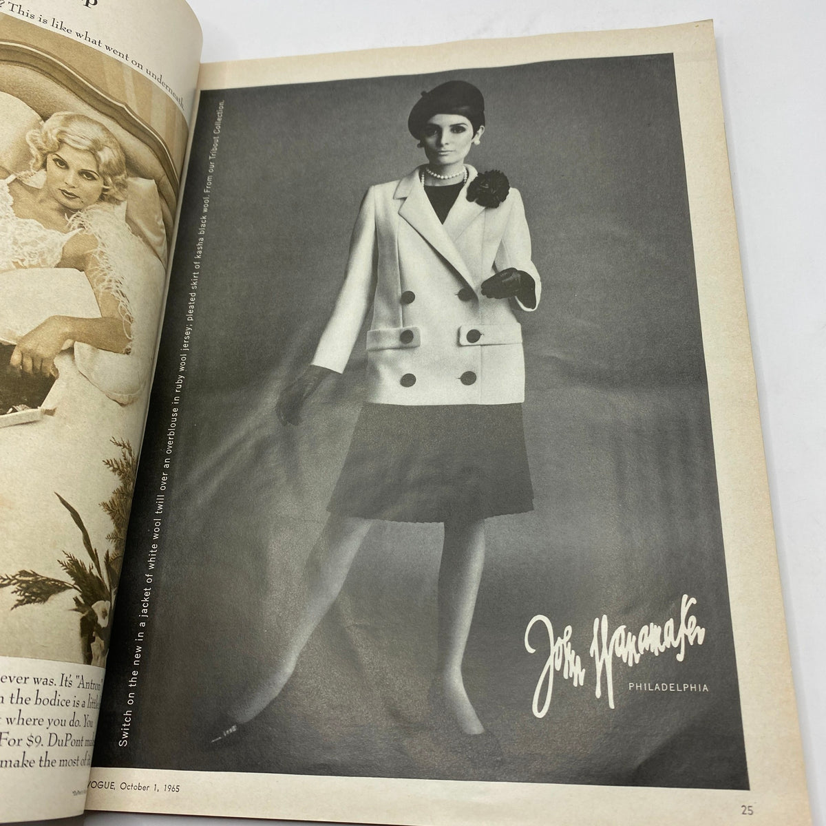 Fashion advertisement from VTG Vogue Magazine October 1 1965 featuring a model in a chic black and white outfit with a hat and elegant accessories.