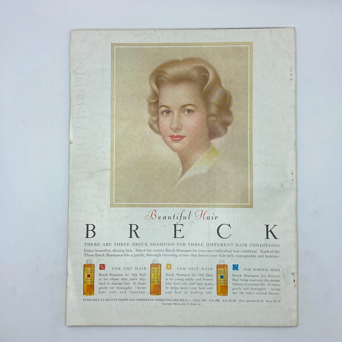 Vintage Vogue Magazine January 15 1963 featuring beautiful hair advertisement for Breck shampoos, showcasing a portrait of a woman with styled hair and information on hair care solutions for different hair types.