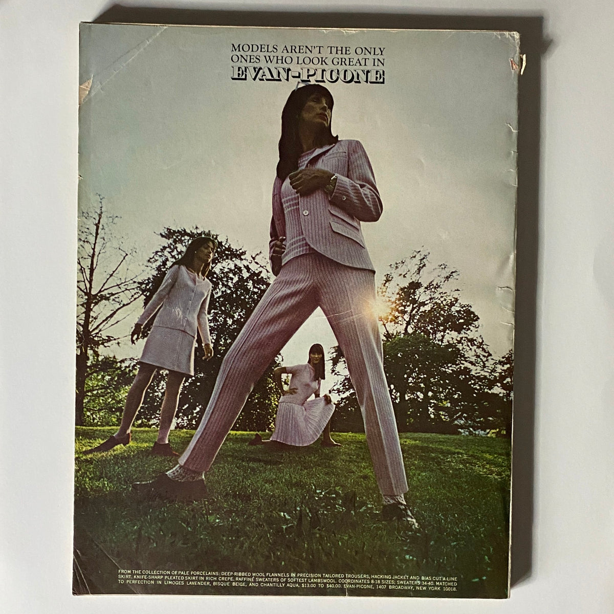 Back cover of VTG Vogue Magazine November 1 1966 featuring models in fashionable attire, emphasizing 1960s fashion history.