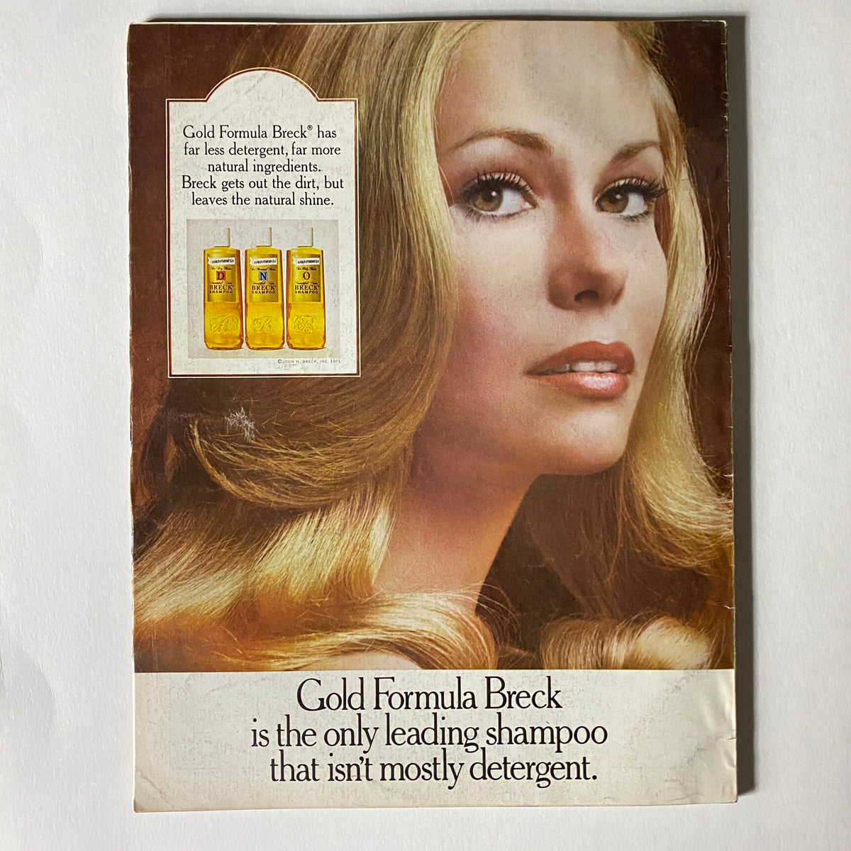 Ad page from VTG Vogue Magazine March 15 1972 featuring Gold Formula Breck shampoo, highlighting its natural ingredients and promoting shine.