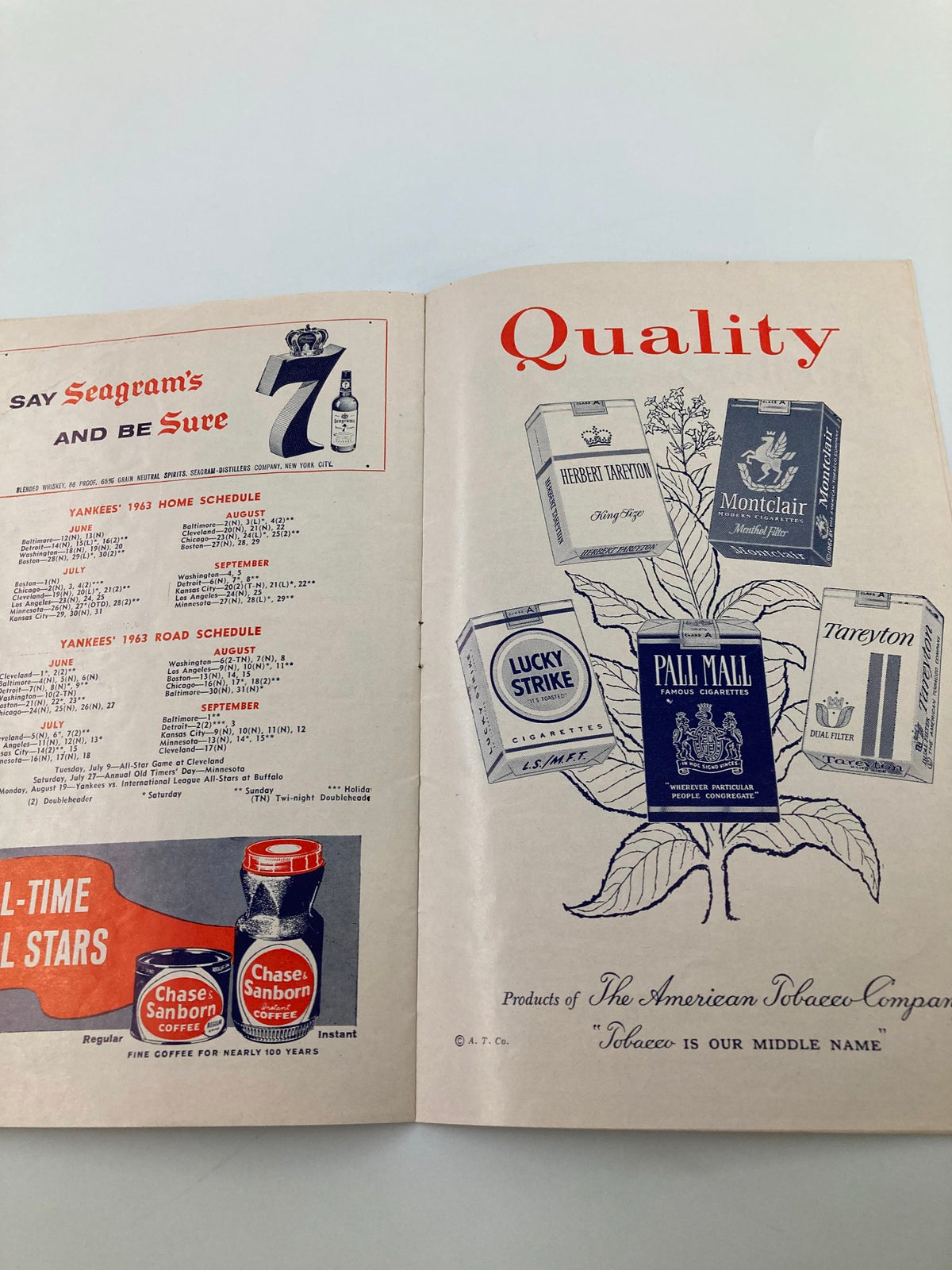 Advertisement page from the 1963 MLB New York Yankees World Champions Official Program and Scorecard featuring tobacco brand promotions and Yankees game schedules.