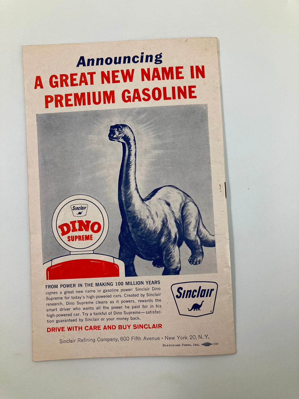 Vintage advertisement featuring a dinosaur silhouette promoting Sinclair Dino Supreme gasoline, titled 'Announcing A Great New Name in Premium Gasoline'.